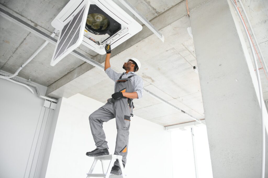 ac-electrician-technician-repairing-air-conditioner-appliance-min